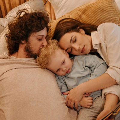 Photo by Pavel Danilyuk: https://www.pexels.com/photo/family-lying-on-bed-7938055/